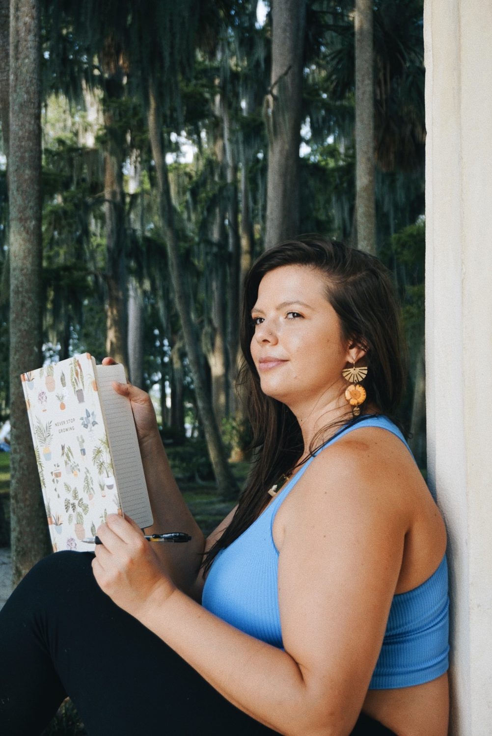 Mandy seated quietly with her journal, gentle presence for complex trauma