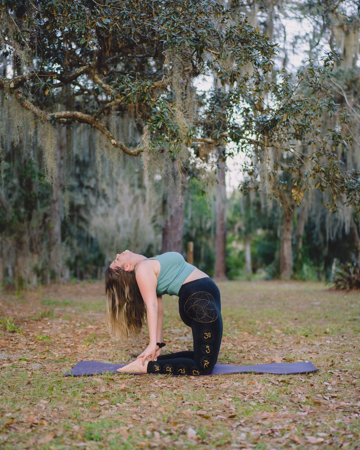 Mandy in a heart opening camel pose, somatic therapist for Tallahassee
